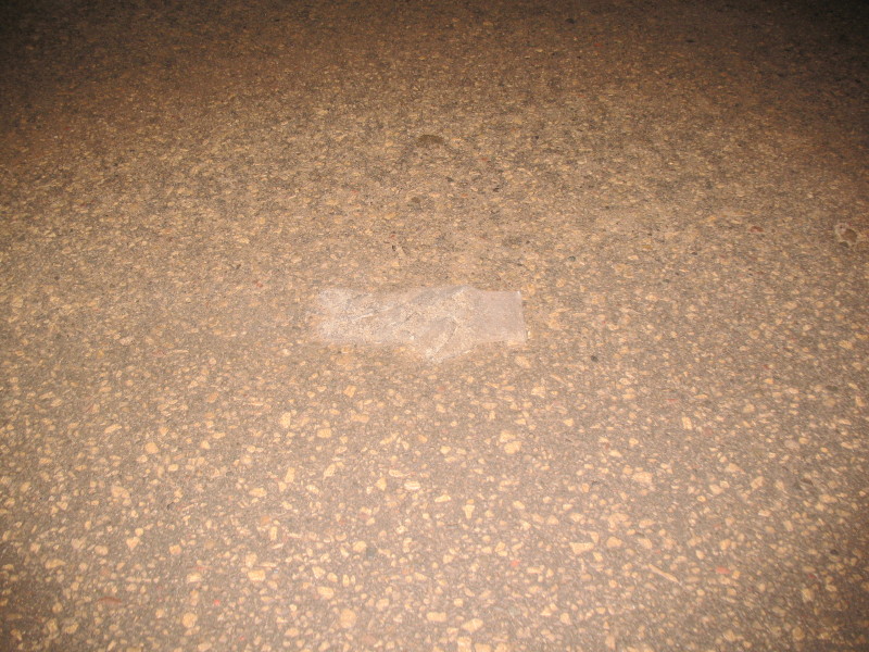 glove under ice in road